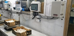Wall-mounted VistaTrac equipment in Champ's Mushroom factory